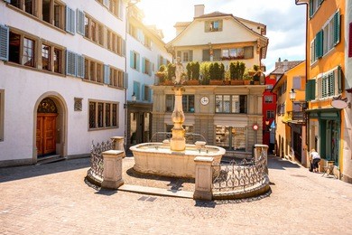 beautiful small square with fountain in the old town of zurich city in switzerland