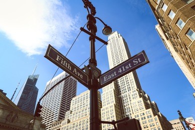 signpost with fifth avenue in new york