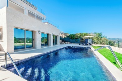 luxury modern house with swimming pool with waterfall jet. house marble