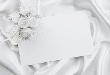 the wedding invitation with a bouquet of the bride on a white background