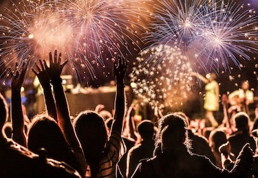 new year concept - cheering crowd and fireworks