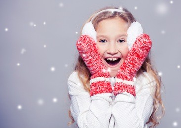 girl in winter clothes. happy child. studio shot