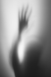 ghostly abstract human shadow reaching upward