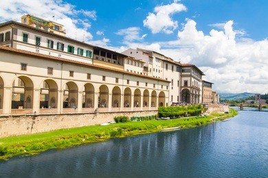the embankment of river arno. view of the uffizi gallery. italy, florence