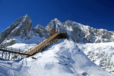 the peak of yulong (jade dragon) snow mountain in lijiang, yunnan province, china