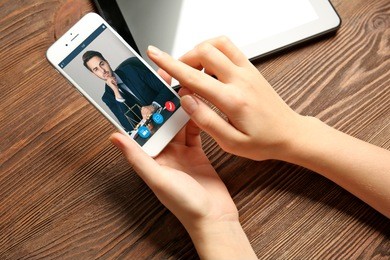 woman video conferencing with lawyer on smartphone. video call and online service concept.