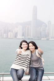 two beauty woman smile and thumb up in hongkong
