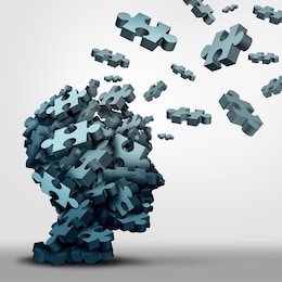 dementia puzzle concept brain health problem symbol as a neurology and psychology icon as a a group of 3d illustration jigsaw pieces shaped as a human head as a mental health or memory loss disorder.