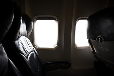 dark tone of seats in economy class passenger on aircraft. empty airplane seats in the cabin
