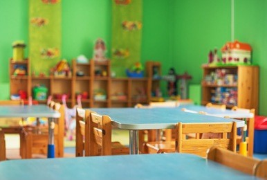 chairs, table and toys. interior of kindergarten.