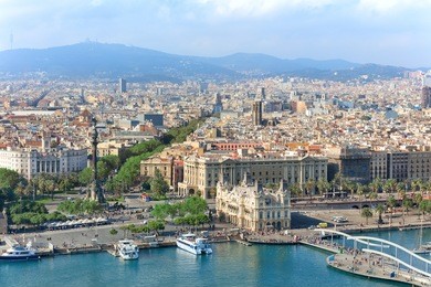 central embankment of barcelona with columbus statue, la rambla street and promenade, spain