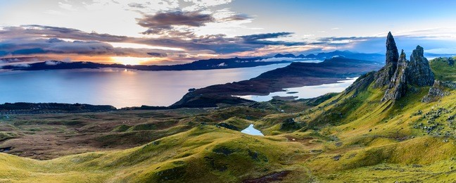 sunrise at the old man of storr - beautiful panorama of an amazing scenery with vivid colors - symbolic tourist attraction - mystery around the landmark - spectacular panorama with first rays of light