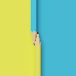 closeup blue and yellow pencil on blue and yellow colors background. minimal concept.