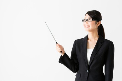 portrait of asian businesswoman pointing isolated on white background