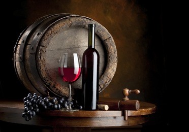 the still life with red wine, bottle, glass and old barrel
