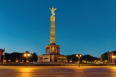 the victory column at the tiergarten in berlin illuminated at night, germany