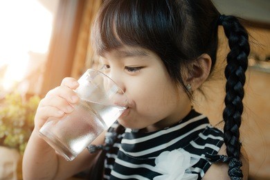 little girl drinking water