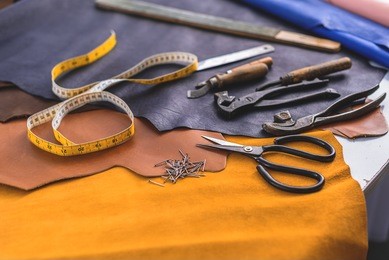 iron cobbler tools on leather