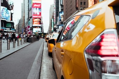 taxi cabs on busy time square road