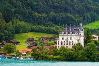 mansion on lake brienz and brienzer rothorn mountain at interlaken in canton of bern in switzerland