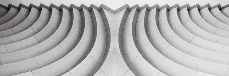 reworked abstract architecture photograph resembling decorative stair-step structure. abstract black-and-white background with original curvilinear pattern.
