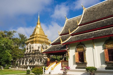 stucco sculpture elephant surrounded pagoda in wat chiang man, chiang mai, thailand.
