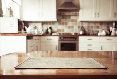 blurred kitchen interior and napkin and desk space