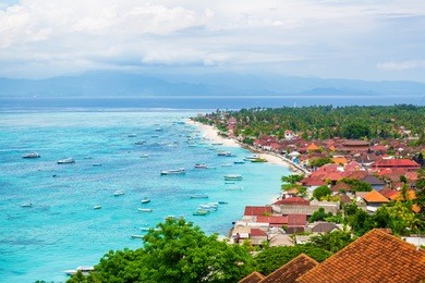 tropical beach, town and ocean in bali
