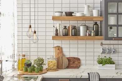 white tiles wall modern kitchen with chopping board, modern lamp
