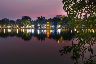 hoan kiem lake, the center of hanoi capital, vietnam at twilight.