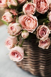bouquet of pink spray roses in basket