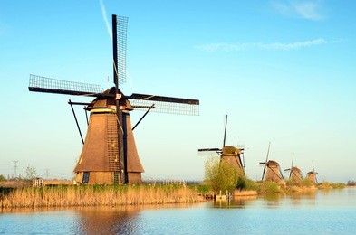 the picturesque landscape with aerial mills on the channel in kinderdiyk, netherlands