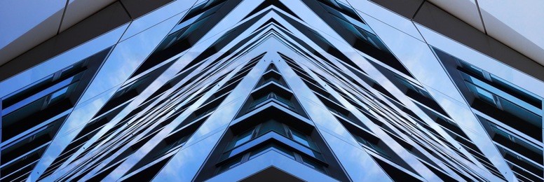 digitally composed photo of office building corner. angular structures. abstract arrow-shaped object of modern architecture.