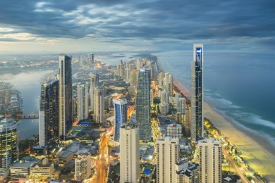 aerial view of modern buildings with light trail at riverside at gold coast, australia during sunset