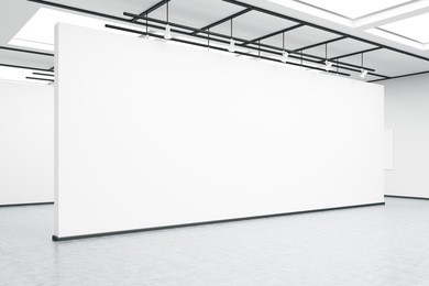 side view of an empty exhibition hall wall. concrete floor, bright lightning. concept of modern art. 3d rendering. mock up.