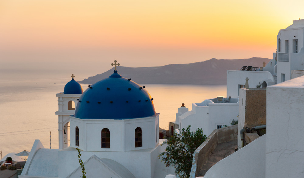 traditional church in imerovigli, santorini, greece, during sunset