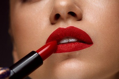red lipstick. closeup of woman face with bright red matte lipstick on full lips. beauty cosmetics, makeup concept. high resolution image