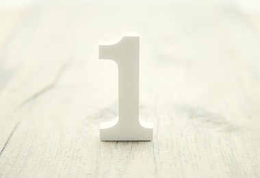 number one on rustic wooden background. top concept. wooden number 1 as symbol of success