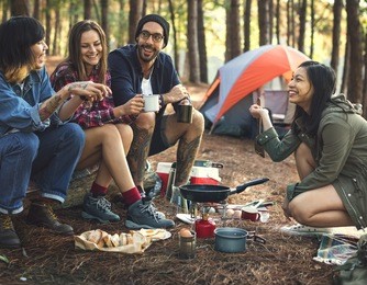 friends camping eating food concept