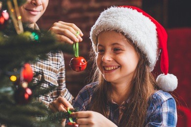 christmas concept. new year. children dress up a christmas tree. kids and christmas toys. boy and girl near a christmas tree