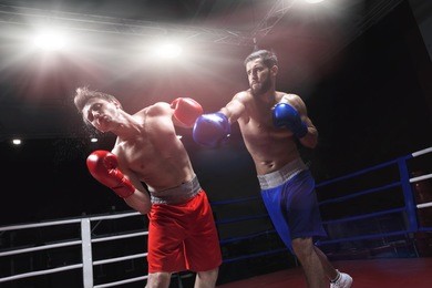boxers fighting in a boxing ring