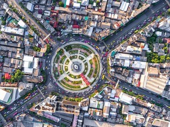 aerial view road roundabout with car lots wongwian yai in bangkok,thailand.street large beautiful downtown at night.cityscape.top view.