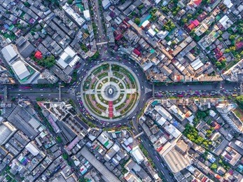 aerial view road roundabout with car lots wongwian yai in bangkok,thailand.street large beautiful downtown at night.cityscape.top view.