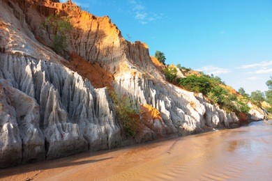 beautiful creek fairy with red and white sandstone in mui ne, vietnam