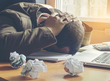 businessman failing and serious in office.