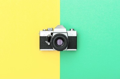 vintage camera on color background. retro style toned picture. minimalistic concept