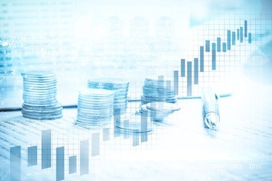 double exposure of city and coin stack on banking account in the background with chart and graph 