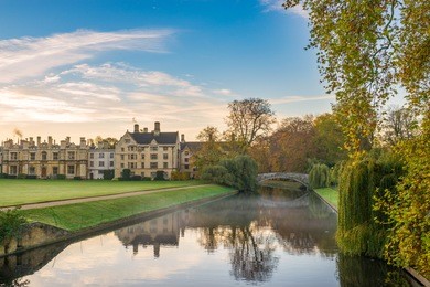 cam river with blue sky at cold foggy morning in cambridge, uk