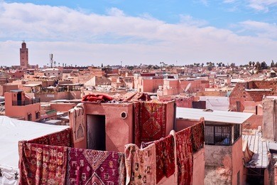 carpets hanging from a roof in the medina marrakech