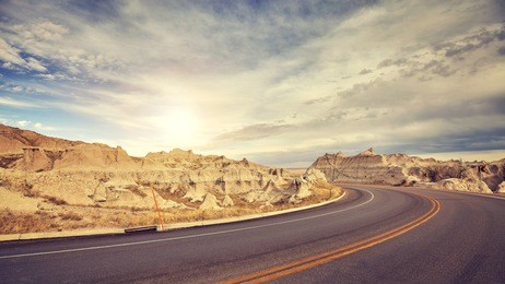 vintage toned desert road just before sunset, travel concept, usa.